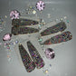 2 Barbie hair clips